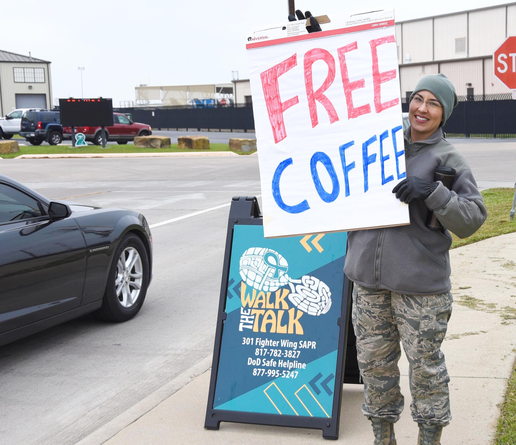 Capt. Chelsea Migura, a 301st Fighter Wing Sexual Assault Prevention and Response Victim Advocate (VA), invites Airmen to have coffee, April 8, 2018 at Naval Air Station Fort Worth Joint Reserve Base, Texas. During the event, Airmen had the opportunity to play games, share why they support SAPR month, and partake in refreshments. (U.S. Air Force photo by Tech. Sgt. Charles Taylor)