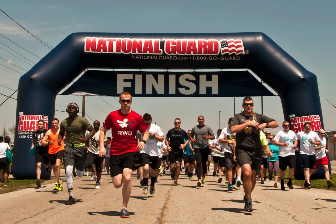 Service members cross the finish line in record time.