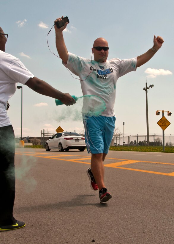 Service member run in Embrace Your Voice 5k Color Run.