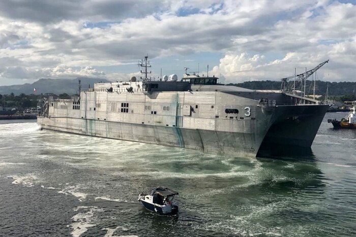 A ship sits in the water.