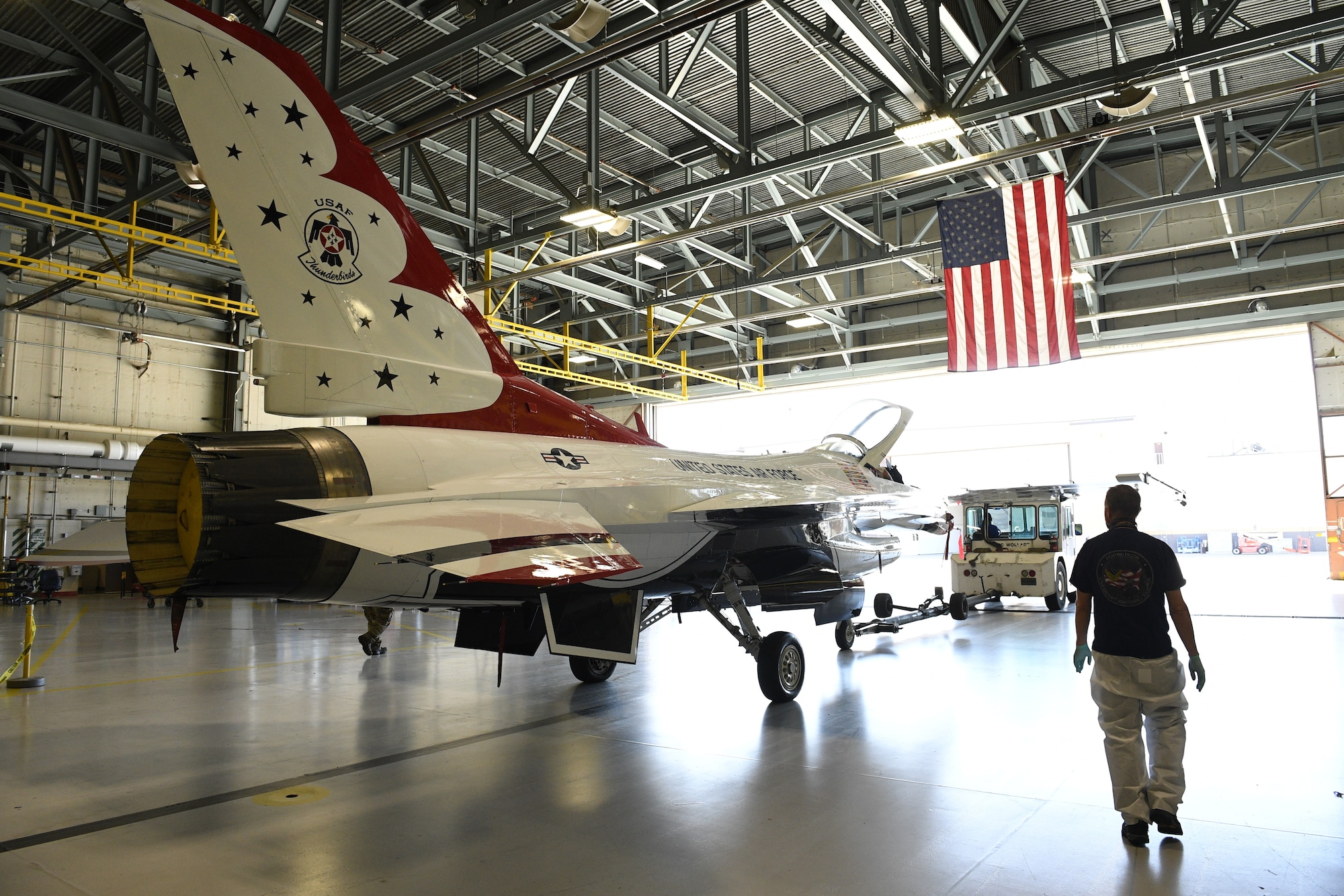 A U.S. Air Force Thunderbird F-16 jet is towed out of a hangar April 26, 2018 at Hill Air Force Base, Utah. The aircraft was the first to receive structural modifications as part of the F-16 Service Life Extension Program, or SLEP, that will keep the jet flying for decades. (U.S. Air Force photo by R. Nial Bradshaw)