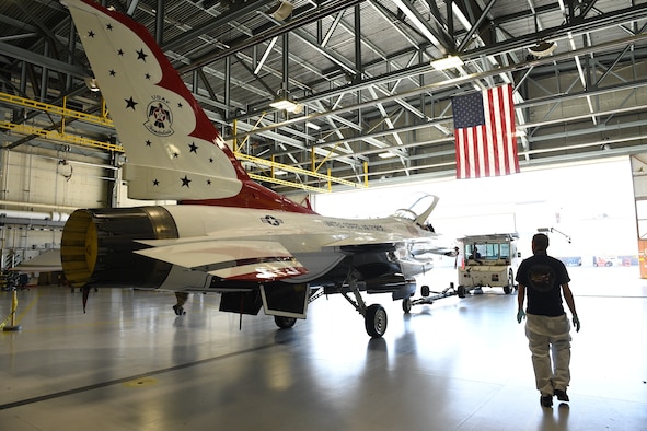 A U.S. Air Force Thunderbird F-16 jet is towed out of a hangar April 26, 2018 at Hill Air Force Base, Utah. The aircraft was the first to receive structural modifications as part of the F-16 Service Life Extension Program, or SLEP, that will keep the jet flying for decades. (U.S. Air Force photo by R. Nial Bradshaw)