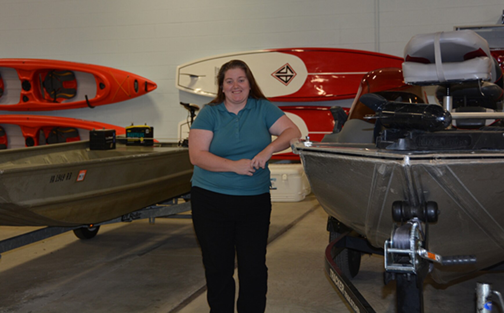 Cutshall poses in front of Outdoor Recreation watercraft