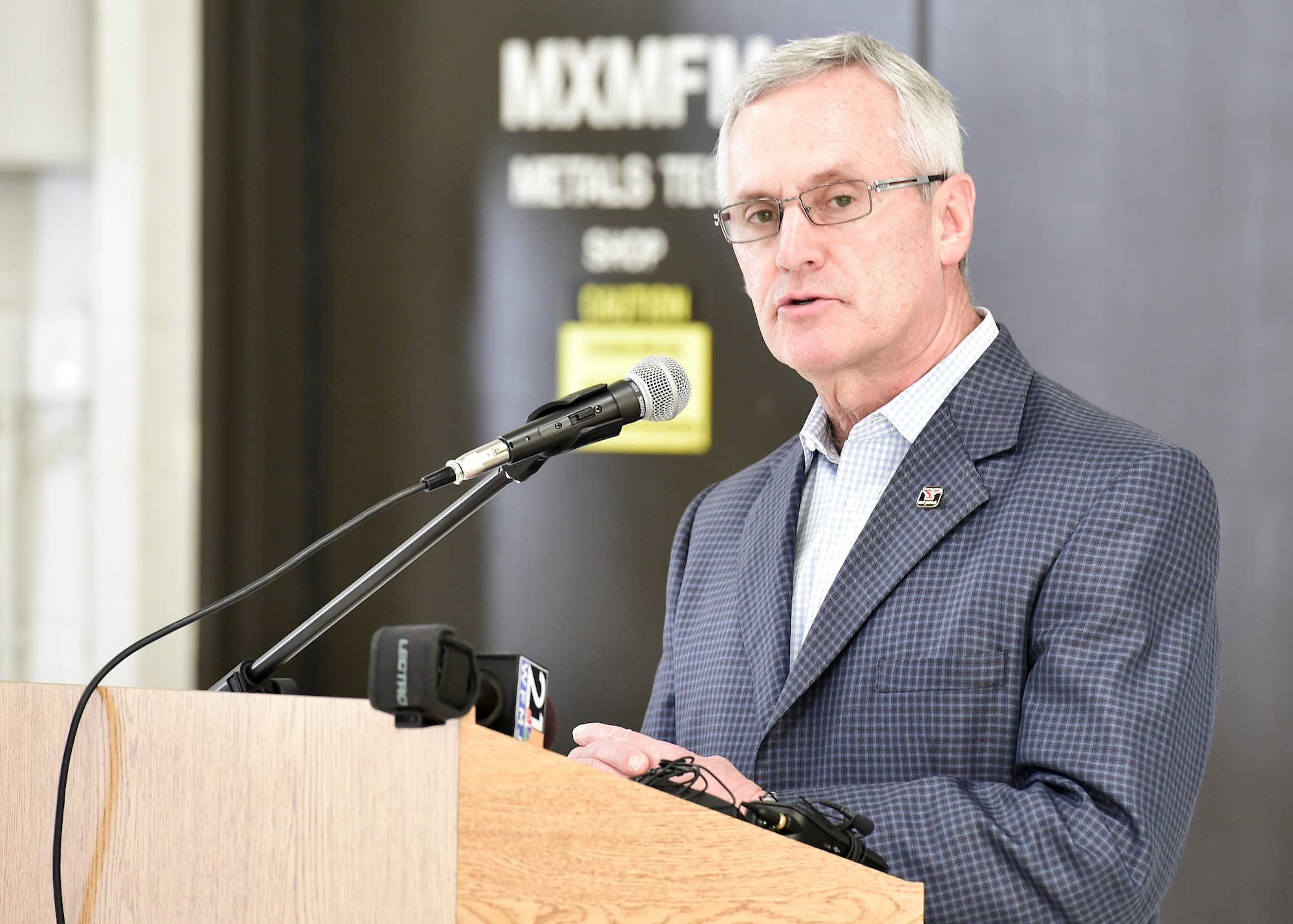 Youngstown State University President Jim Tressel gives remarks during a ceremony to unveil a new C-130H Hercules tail flash and nose art here, May 3, 2018.