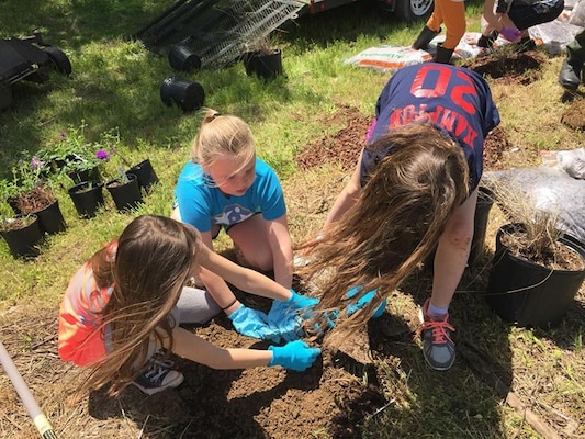 These Girl Scouts from Troop 390 plant native plants and grasses April 28, 2018 that will become an Ecological Landscape Exhibit for visitors to Cheatham Lake in Ashland City, Tenn. (USACE photo by Trey Church)