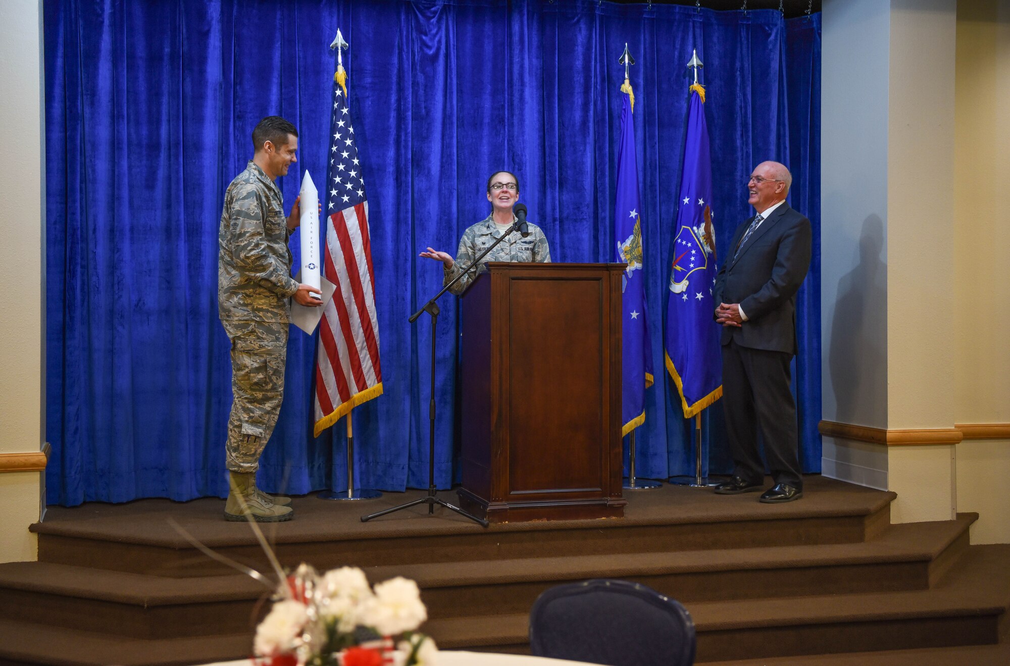 A luncheon was held for the National Day of Prayer on F.E. Warren Air Force Base, Wyo., May 2, 2018. The keynote speaker Chaplin, Maj. Gen. (Ret) Cecil Richardson, former chief of chaplains was presented with a thank you gift by Col. Stacy Jo Huser, 90th Missile Wing commander. The NDP is a commander-run program hosted by the Chaplains and it is meant to recognize our constitutional right of prayer and understand that each religion is rooted in a background of prayer. (U.S. Air Force photo by Airman 1st Class Abbigayle Wagner)