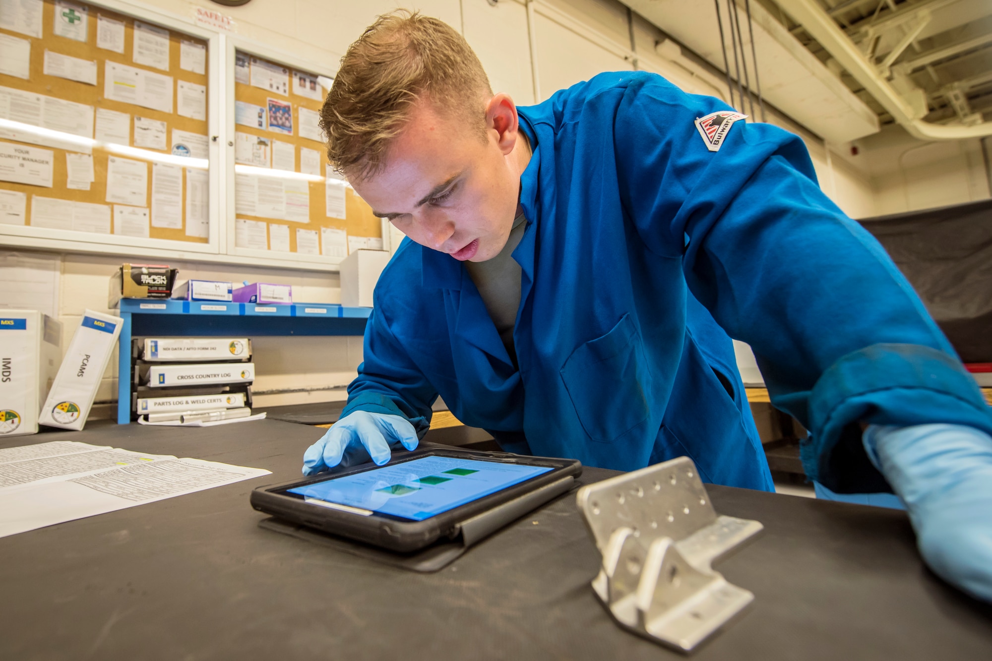 Senior Airman Matthew Horne, 23d Maintenance Squadron non-destructive inspection (NDI) specialist, reads a technical order, May 2, 2018, at Moody Air Force Base, Ga. NDI technicians use various methods to complete these inspections such as X-ray, florescent dye penetrant, oil analysis and ultrasonic scanning to examine and inspect numerous aircraft parts and components to ensure that they are in usable condition. (U.S. Air Force photo by Airman 1st Class Eugene Oliver)