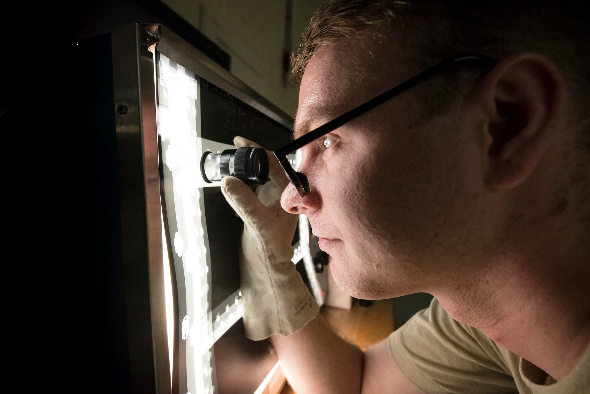 Senior Airman Austin Aldridge, 23d Maintenance Squadron non-destructive inspection (NDI) specialist, inspects an aircraft part through an X-ray, May 2, 2018, at Moody Air Force Base, Ga. NDI technicians use various methods to complete these inspections such as X-ray, florescent dye penetrant, oil analysis and ultrasonic scanning to examine and inspect numerous aircraft parts and components to ensure that they are in usable condition. (U.S. Air Force photo by Airman 1st Class Eugene Oliver)