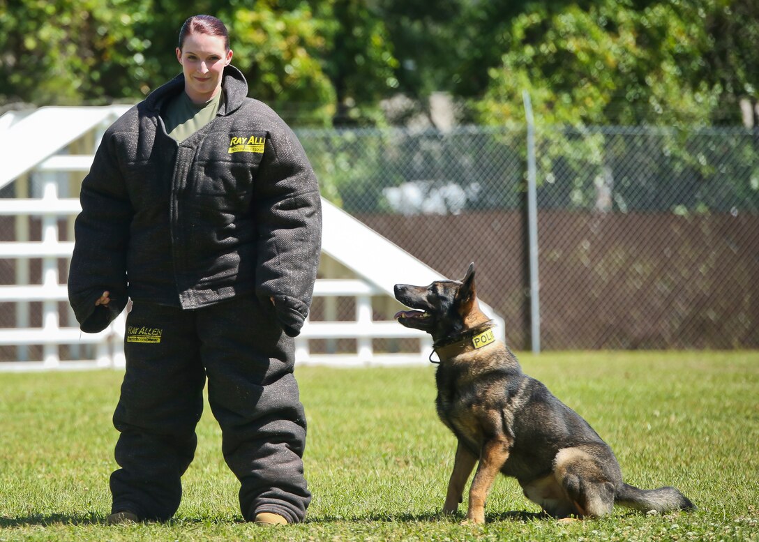 Lance Cpl. Sarahann Temple assists in a Military Working Dog demonstration aboard Marine Corps Air Station Beaufort May 1. The demonstration was held for students from Beaufort Middle School to showcase one of the main assets of the air station. Temple is a military policeman with the Provost Marshals Office.