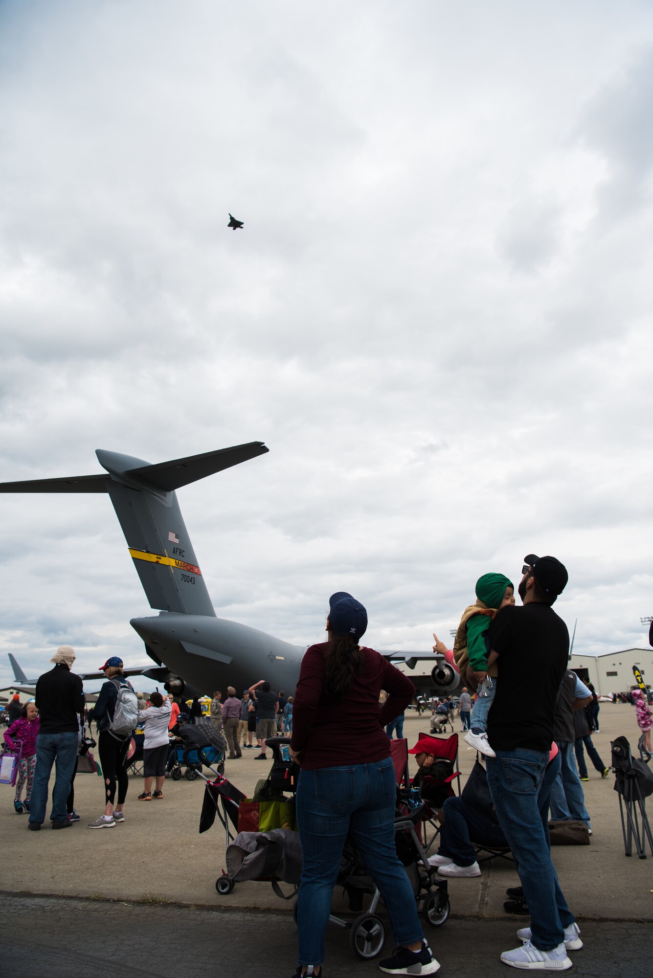 Visitors watch the F-22 Raptor demonstration during the Air and Space Expo April 28, 2018, at Beale Air Force Base, Calif. This was beale's first airshow since 2011. (U.S. Air Force photo/ Senior Aimran Justin Parsons)