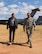 Simon Sinek, author and optimist, and U.S. Air Force Col. Scott Campbell, 355th Fighter Wing commander, walk through the 309th Aerospace Maintenance and Regeneration Group at Davis-Monthan Air Force Base, Ariz., May 2, 2018.