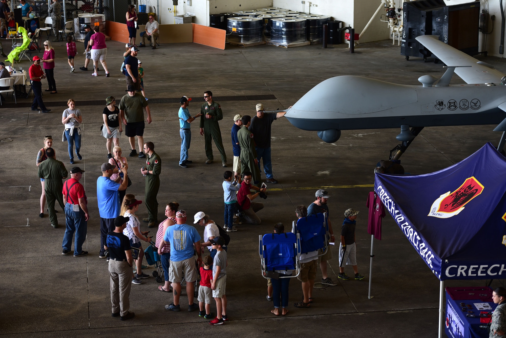 Spectators get an up-close and personal look at the MQ-9 Reaper April 28, 2018, during the Joint Base Charleston Air & Space Expo at JB Charleston, S.C. During the air show more than 80,000 spectators had the opportunity to learn about the MQ-9 and its mission from the Airmen who fly, maintain and support it. (U.S. Air Force photo by Senior Airman Christian Clausen)