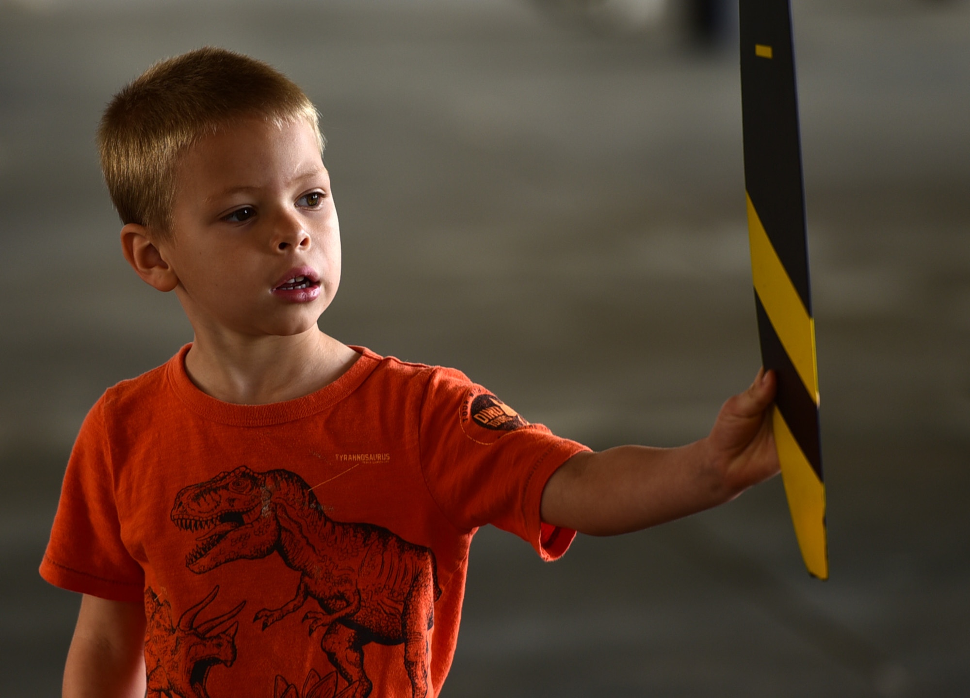 Damian Kemp, five, son of Tech. Sgt. Roger Kemp, 628th Civil Engineering Squadron fire fighter, inspects the propeller of an MQ-9 Reaper April 27, 2018, at the Joint Base Charleston Air & Space Expo at JB Charleston, S.C. During the event, spectators received an up-close and personal look at the Reaper and interacted with the crews who fly, maintain and support the aircraft and its mission. (U.S. Air Force photo by Senior Airman Christian Clausen)