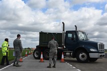 An Airman assigned to the 100th Logistic Readiness Squadron parallel parks a tractor trailer during a course inspection at Royal Air Force Mildenhall, England, April 26, 2018. The inspection verified procedures and the course layout to be used for a commercial driver’s licensure program. (U.S. Air Force photo/Senior Airman Abby L. Finkel)