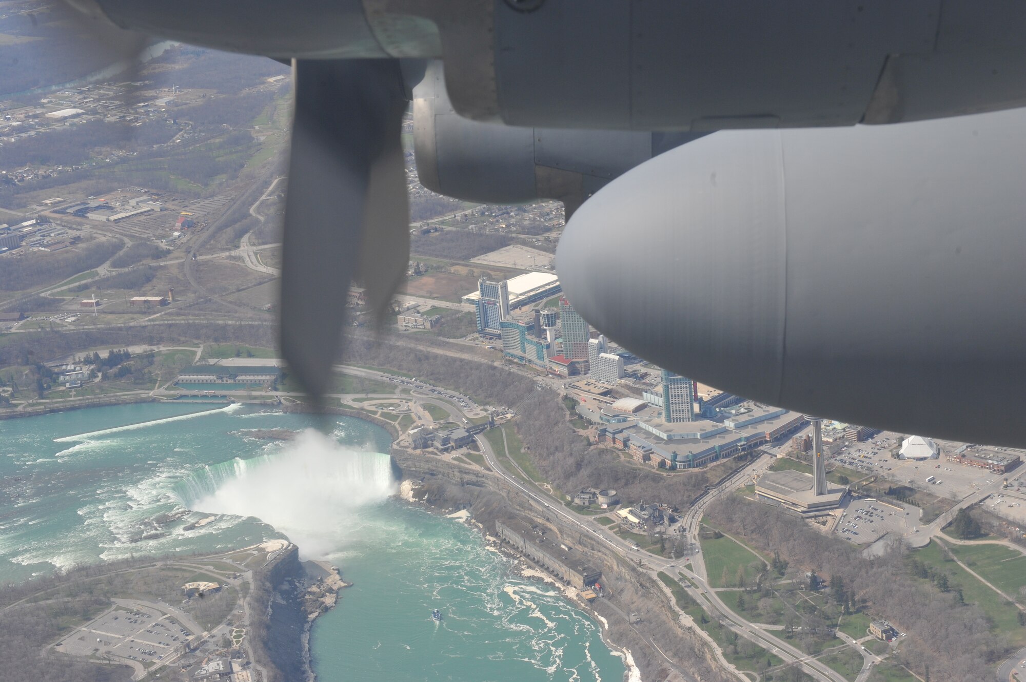 Niagara Falls is seen through a side window of a C-130H Hercules during a Youngstown Air Reserve civic leader flight on April 27, 2018.