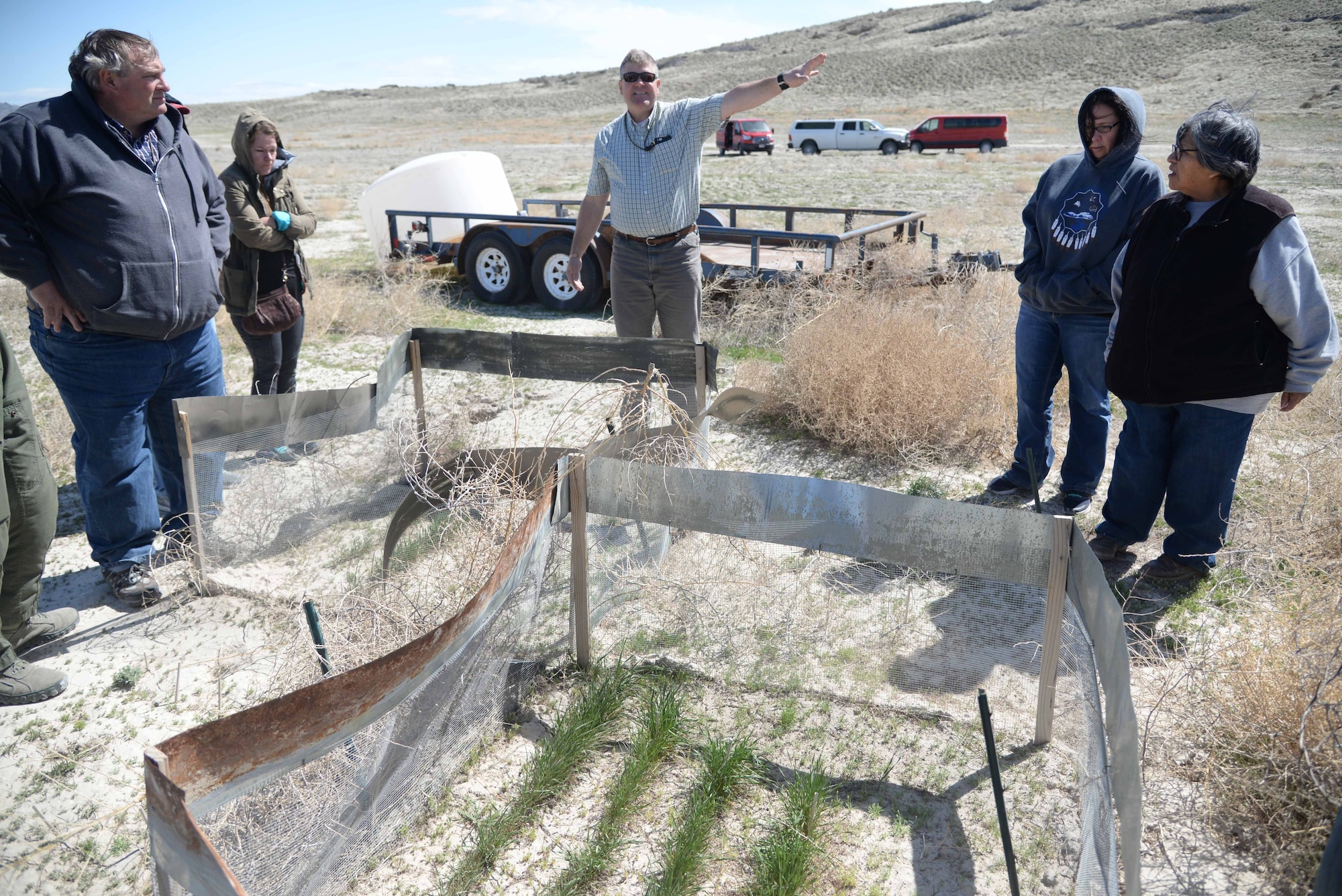 Russ Lawrence, Natural Resources Manager at the Utah Test and Training Range, discsses how the UTTR is gradually working on getting rid of cheat grass and cultivating more natural growth of better and nutritious vegetation for the land and wildlife. The exchange occurred on a tour of the range April 20, 2018, during Annual American Indian Meeting, in which Hill Air Force Base was a co-host. The meeting was held for government-to-government conversations, tours of UTTR, and official tribal co-host presentations. (U.S. Air Force photo by Cynthia Griggs)