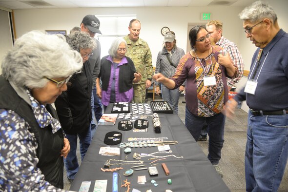 Eldrick Seoutewa (at right), an artist from Zuni Pueblo, New Mexico, demonstrates his jewelry for the attendees of the  Annual American Indian Meeting held at the Utah Test and Training Range April 20, 2018, in which Hill Air Force Base was a co-host. The meeting was held for government-to-government conversations, tours of UTTR, and official tribal co-host presentations. (U.S. Air Force photo by Cynthia Griggs)
