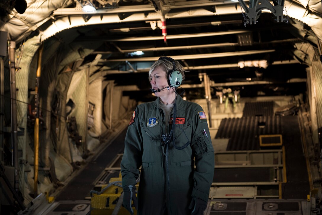 U.S. Air Force Master Sgt. Lacey Dilbeck, a loadmaster from the 169th Airlift Squadron, Illinois Air National Guard, prepares for a flight on a C-130H Hercules in Peoria, Ill., April 19, 2018.