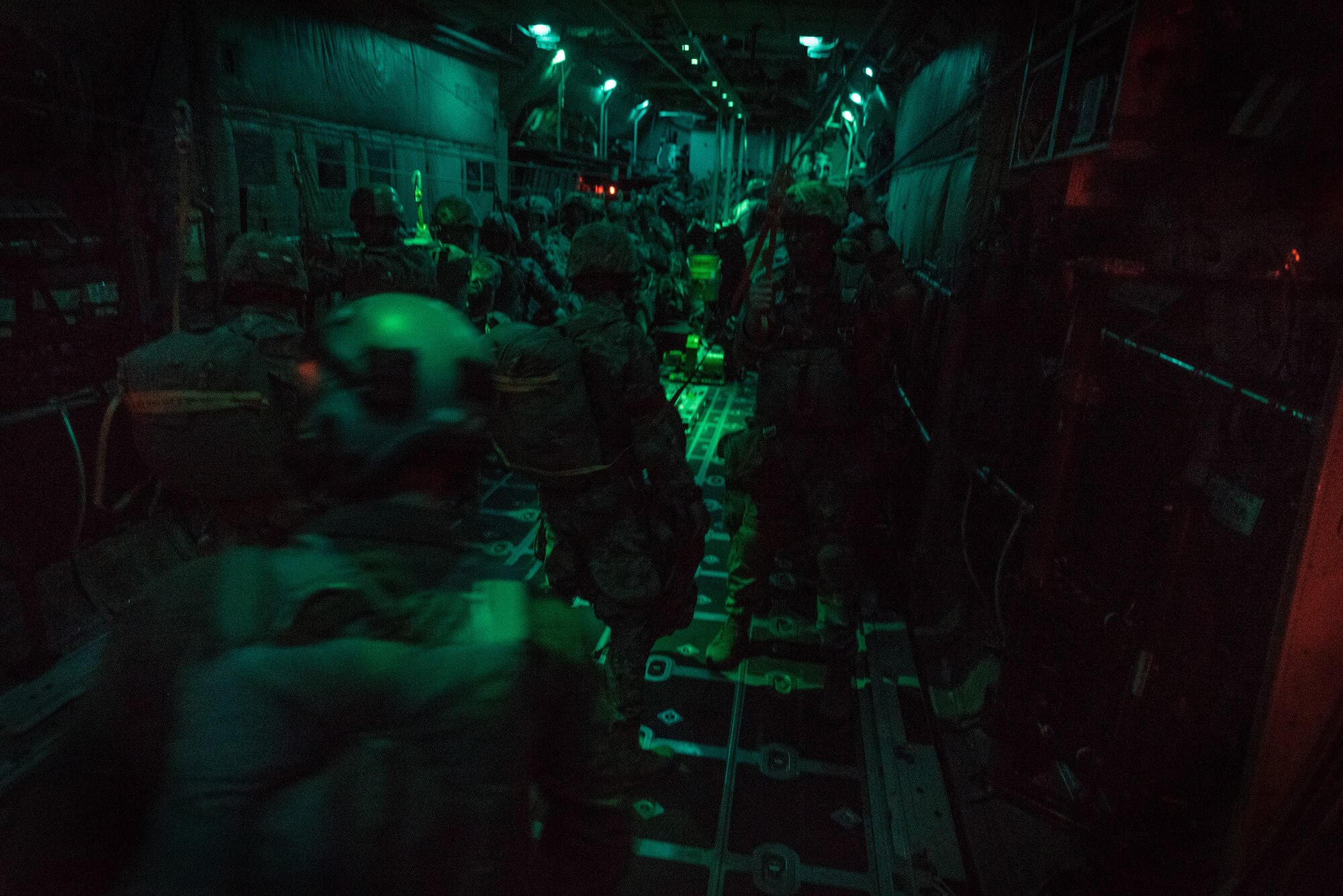 Paratroopers with 1st Battalion (Airborne), 143rd Infantry Regiment, Texas Army National Guard, prepare to initiate an airborne assault by jumping from a C-130H Hercules over Denison, Texas, April 20, 2018.