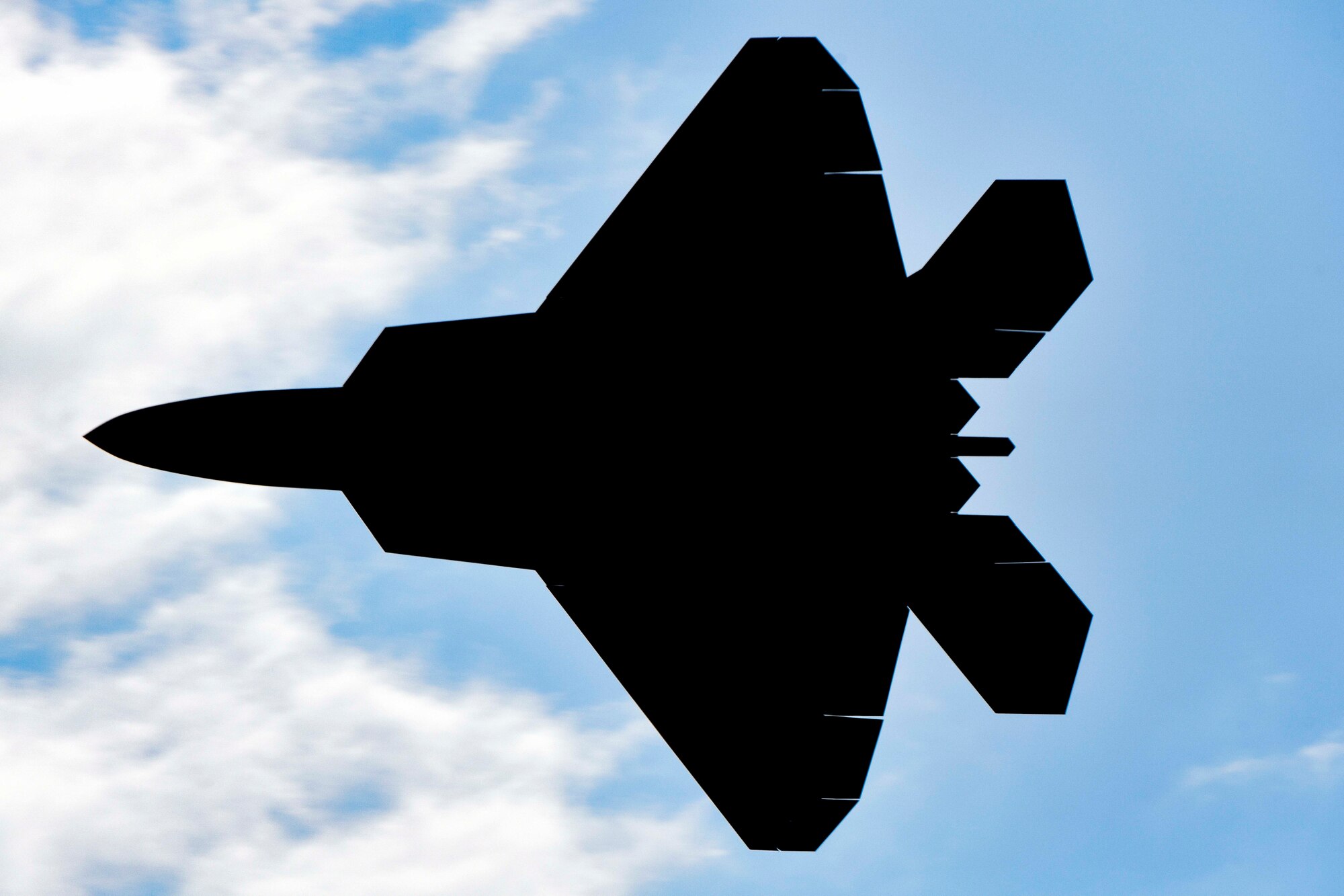 A U.S. Air Force F-22 Raptor performs a dedication pass during Beale's Air & Space Expo Family Day at Beale Air Force Base, Calif., April 27, 2018. The F-22 was the premier fighter jet showcased during the weekend performance. (U.S. Air Force photo by Senior Airman Kaylee Dubois)