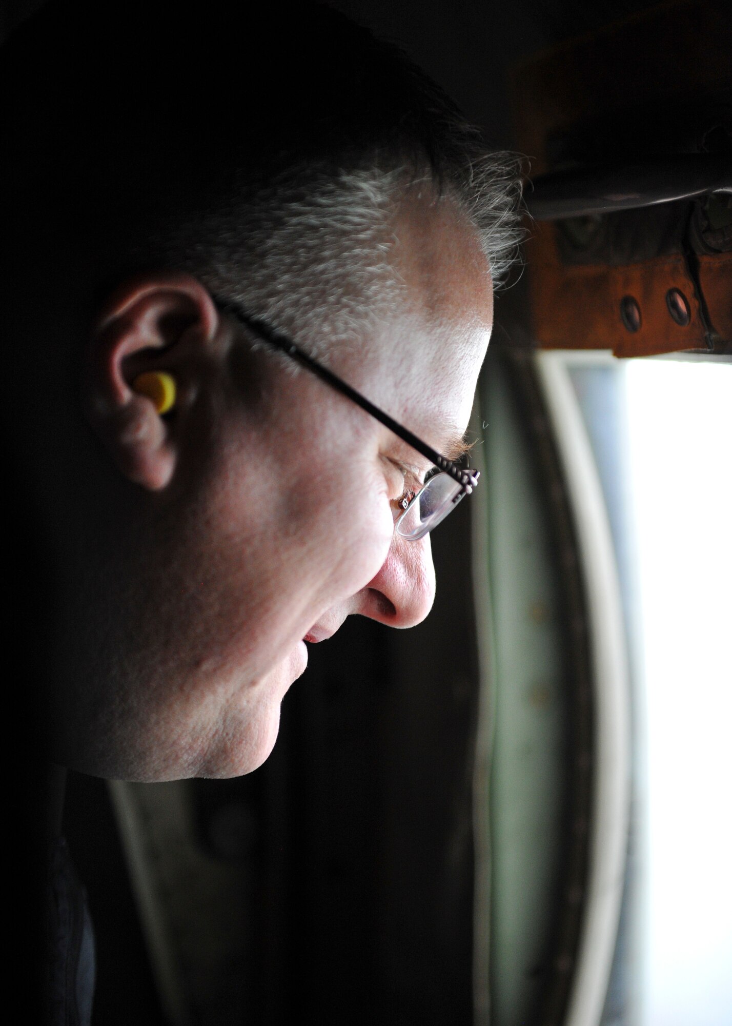 Robert Castanegro with WESCO Distribution, looks out the side window of a C-130H Hercules during a Youngstown Air Reserve Station civic leader flight over Niagara Falls April 27, 2018.