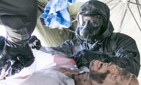 Spc. James Namata, CBRN specialist with Maryland National Guard's 231st Chem. Co., conduct decontamination training during exercise Guardian Response 18 at Muscatatuck Urban Training Center in Indiana on April 12, 2018. The exercise is linked to Vibrant Response 18 and is the multi-component U.S. Army North annual disaster response exercise is designed to validate nearly 5,200 military and government civilian personnel in the event of a Chemical, Biological, Radiological and Nuclear (CBRN) disaster. (U.S. National Guard Photo by Sgt. Allen Griffith)