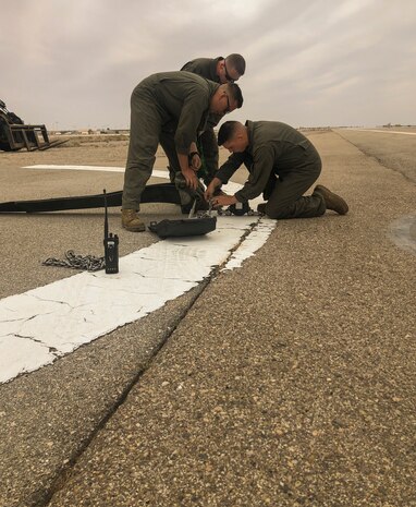 Aircraft Recovery Marines stationed at Marine Corps Air Station (MCAS) Yuma assigned to Headquarters & Headquarters Squadron (H&HS), perform annual certification on their E-28 Arresting Gear in support of all tailhook aircraft aboard MCAS Yuma. The arresting gear helps aircraft perform emergency landings when necessary. (U.S. Marine Corps photo by Lance Cpl. Sabrina Candiaflores)