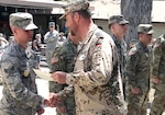 An Airman from the 93rd Intelligence squadron receives a German Armed Forces Proficiency Badge during a ceremony.