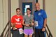 Col. Brent Merritt, 94th Airlift Wing commander; Senior Airman David Flynn, 94th Aeromedical Staging Squadron; and Capt. Rebecca Nistler, 94th Operations Group, pose for a photo after the Falcon 5k Sept. 13, 2015, at Dobbins Air Reserve Base, Ga. Flynn and Nistler were the first male and
female finishers of the fun run sponsored by the Dobbins Top 3. (U.S. Air Force photo/Staff Sgt. Kelly Goonan)
