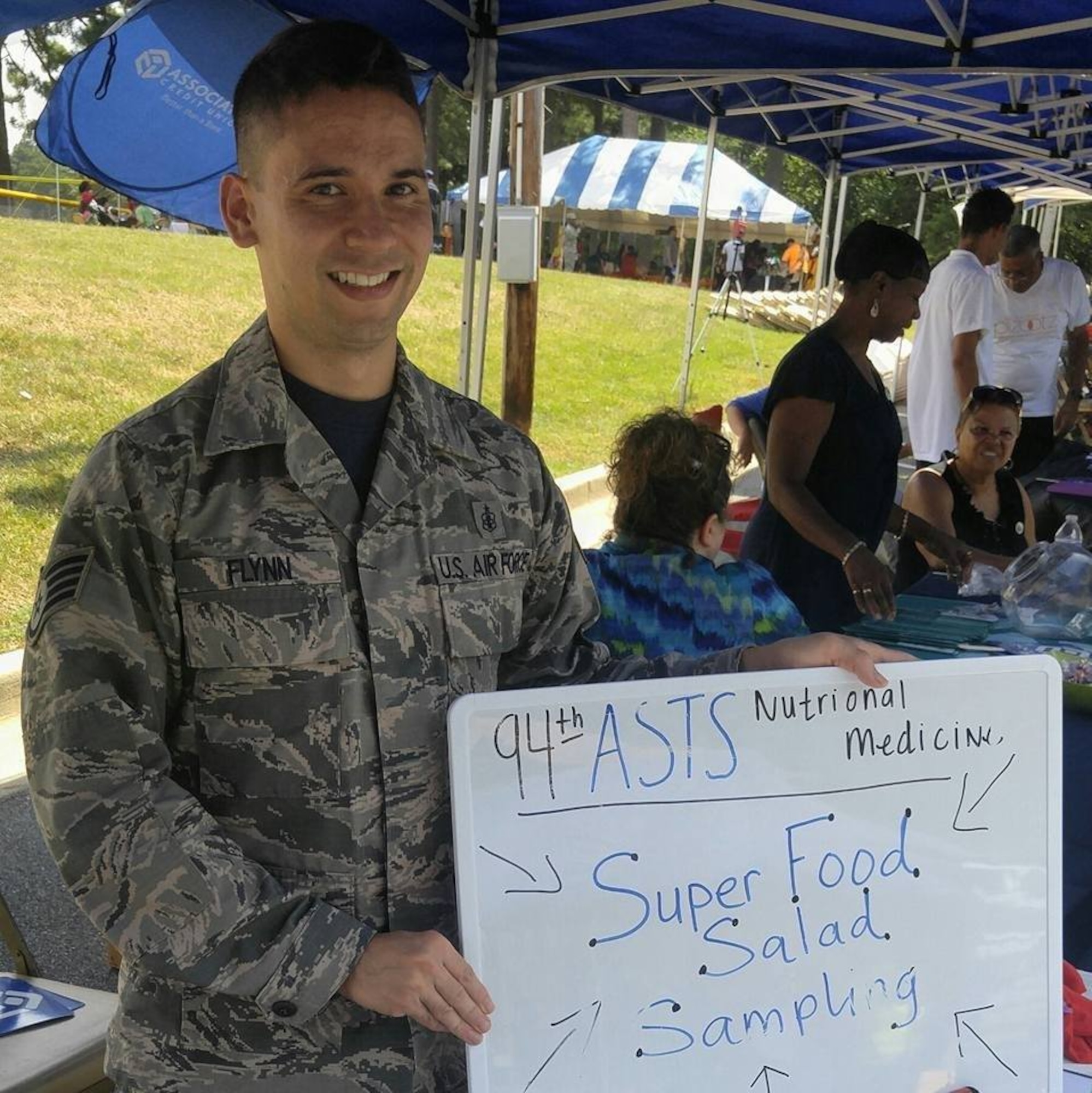 Staff Sgt. David Flynn, 94th Aeromedical Staging Squadron diet technician, samples his Super Food Salad at Dobbins Family Day. Flynn works as a Diet Technician to improve the overall health of his fellow Citizen Reserve Airmen. (Courtesy photo)