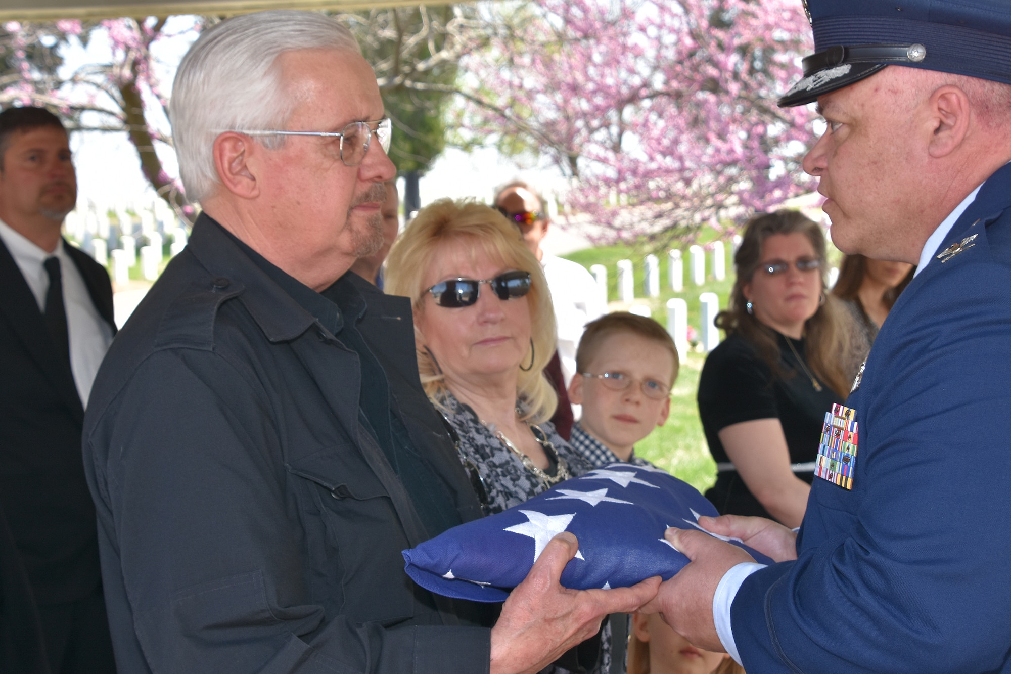 Col. Ken Eaves, 131st Bomb Wing commander, presents Jeffrey Zumwalt a tribute flag in honor of Zumwalt’s father, Brig. Gen. Harding Zumwalt, during a ceremony at Jefferson Barracks National Cemetery, April 30, 2018. Family, friends and Missouri Air National Guard family met to celebrate the life of the World War II combat aviator and former 131st Tactical Fighter Wing commander, Brig. Gen. Harding Zumwalt, who passed away in January at age 97.  (U.S. Air National Guard photo by Senior Master Sgt. Mary-Dale Amison)
