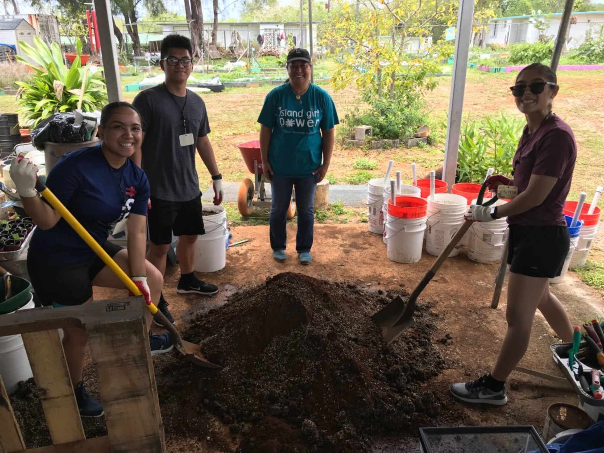 Members of the Air Force Reserve’s 624th Regional Support Group’s Development and Training Flight, from left to right: trainee Charese Santos, Sherwin Nucum, Island Girl Power representative and Breanna Aguon volunteer April 18, 2018, in Dededo, Guam, to plant vegetables for a non-profit organization Island Girl Power during their unit training assembly. The D&TF is a program designed to prepare new enlistees physically and mentally for basic training. (Courtesy photo)
