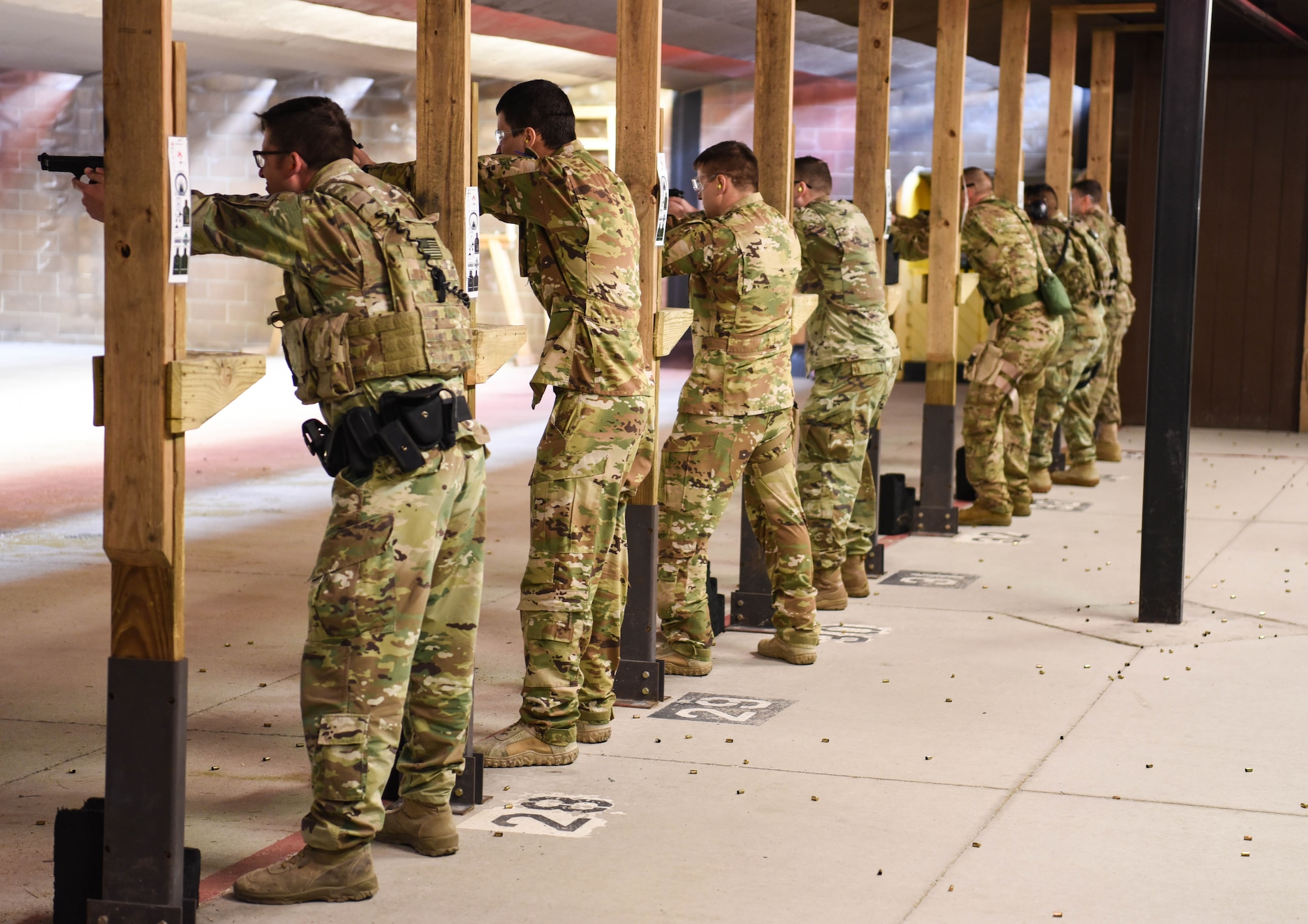 Defenders from the 90th Security Forces Group aim their weapons March 23, 2018, at the Combat Arms Training and Maintenance range on F.E. Warren Air Force Base Wyo. Security forces members have to complete sustainment firing, such as Shoot Move Communicate. Combat Arms Training and Maintenance is a vital component to keeping our Airmen trained and qualified on the weapon systems they are issued whether providing security on home station or deployed. (U.S. Air Force photo by Airman 1st Class Braydon Williams)