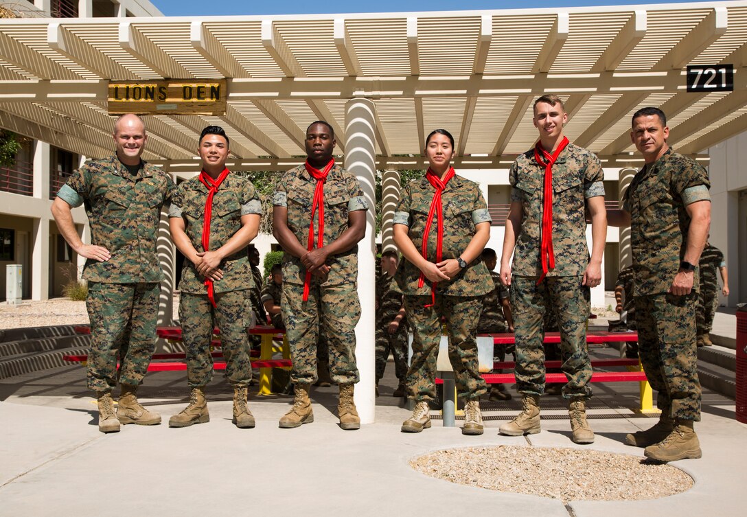 Newly promoted U.S. Marine Corps corporals assigned to Marine Corps Air Station (MCAS) Yuma Headquarters & Headquarters Squadron (H&HS) received their blood stripes during a Blood Stripe Ceremony in front of the H&HS building May 3, 2018. The blood stripe honors the blood that was shed by Marine officers and noncommissioned officers (NCO) during the Battle of Chapultepec in 1847. The blood stripes are sewn on the trousers of NCOs, Staff NCOs, and officers in remembrance of those who courageously fought in the battle. (U.S. Marine Corps photo by Lance Cpl. Sabrina Candiaflores)