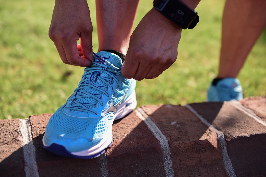 U.S. Army Master Sgt. Jessica Begay, U.S. Army Training and Doctrine Command Inspector General assistant inspector general, ties her shoe in Yorktown, Virginia, May 2, 2018. Begay’s passion for self-improvement was sparked when she participated in a Navajo ceremony as a teen. (U.S. Air Force photo by Airman 1st Class Monica Roybal)