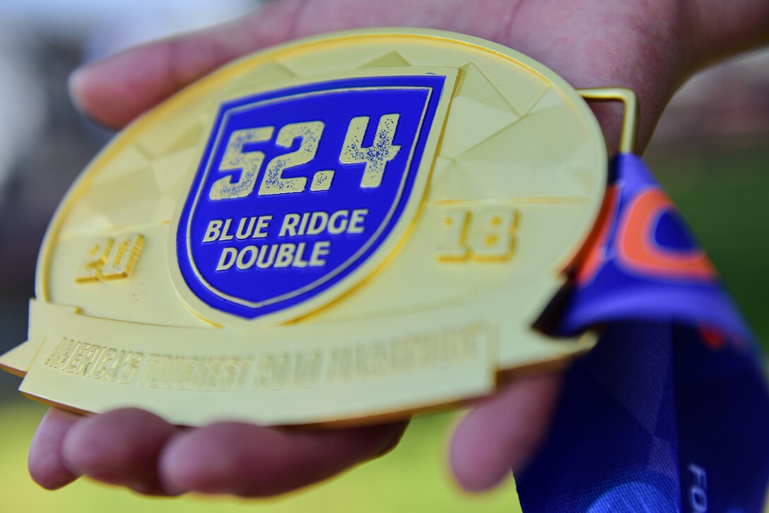 U.S. Army Master Sgt. Jessica Begay, Training and Doctrine Command Inspector General assistant inspector general, hold her medal in Yorktown, Virginia, May 2, 2018. Begay said the medal reminds her that she can accomplish anything once she sets her minds to it. (U.S. Air Force photo by Airman 1st Class Monica Roybal)