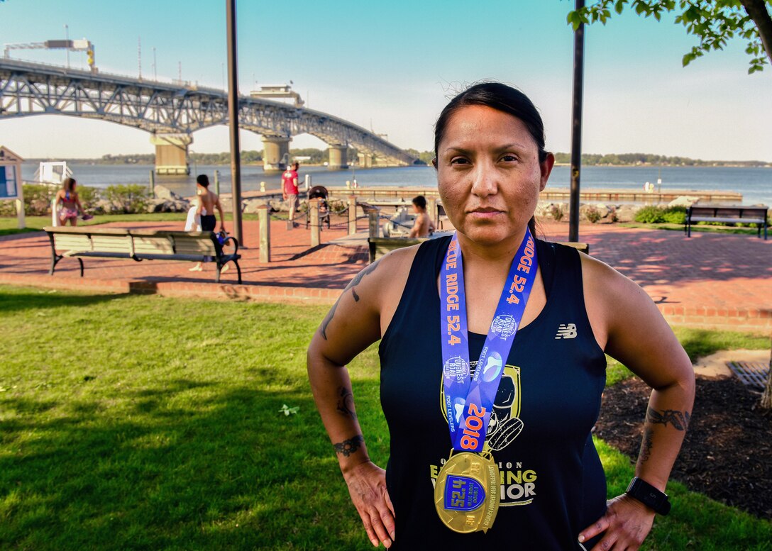 U.S. Army Master Sgt. Jessica Begay, U.S. Army Training and Doctrine Command Inspector General assistant inspector general, poses in Yorktown, Virginia, May 2, 2018. Begay participates in different group runs each day of the week as a way to maintain running stamina while spending time with friends. (U.S. Air Force photo by Airman 1st Class Monica Roybal)