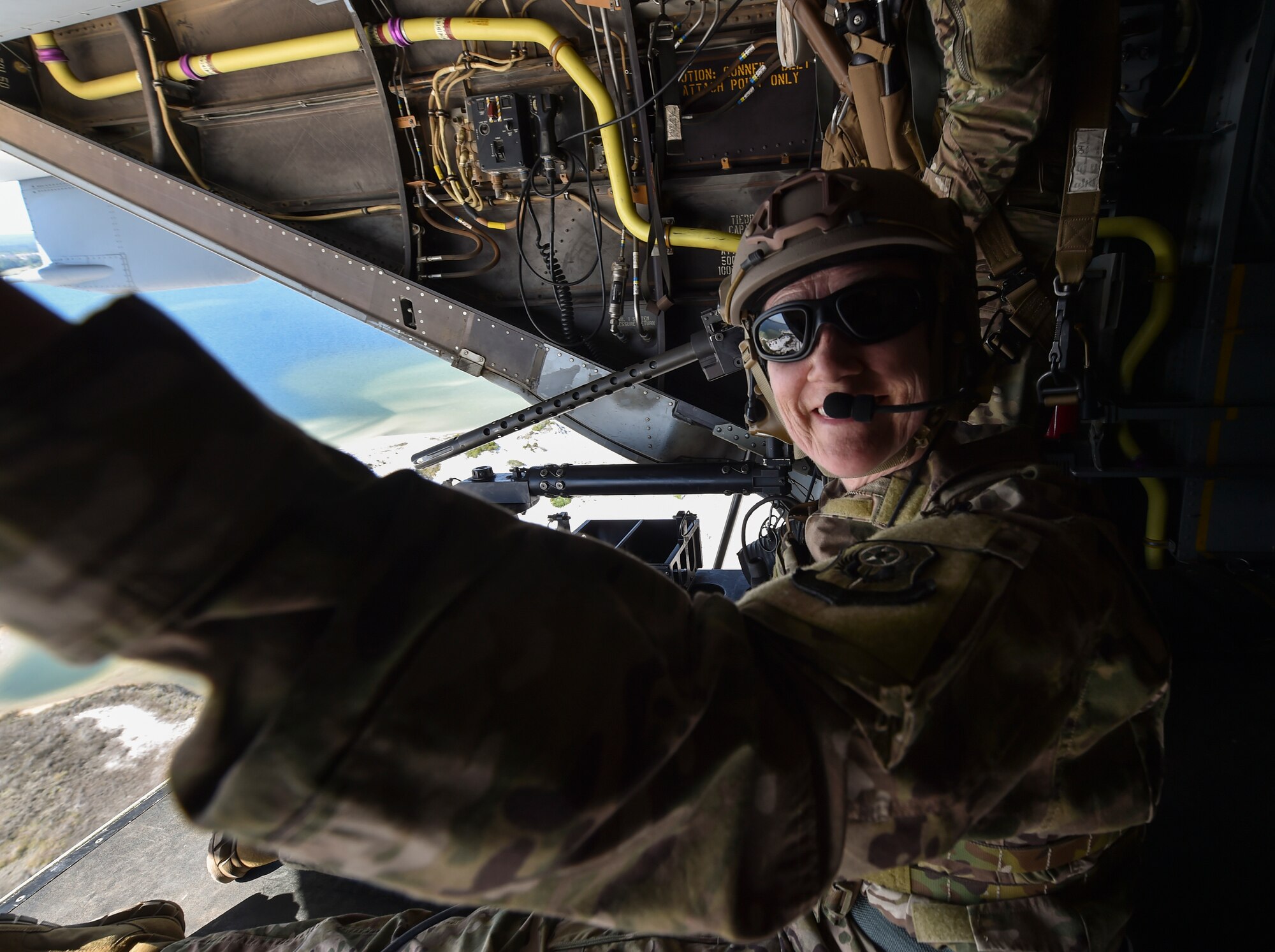 Secretary of the Air Force Heather Wilson rides a CV-22 Osprey over the Emerald Coast during a familiarization flight on May 3, 2018, at Hurlburt Field, Fla. Wilson visited Air Commandos, talked with senior leadership, engaged local community leaders and immersed herself in Air Force Special Operations Command mission capabilities during a visit to Hurlburt Field from May 2-4. (U.S. Air Force photo by Staff Sgt. Ryan Conroy)