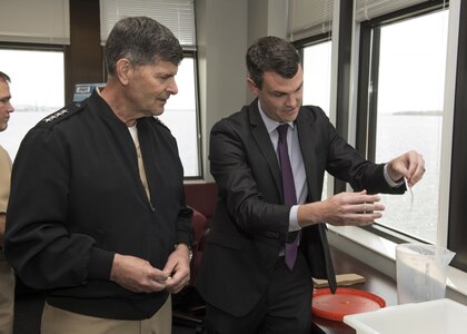 Dr. Ryan Kincer, a scientist at Naval Surface Warfare Center Panama City Division, explains to the Vice Chief of Naval Operations Adm. Bill Moran, USN, how he and his scientific team are conducting research to understand how the slime from hagfish is being used to develop novel materials for naval applications. The VCNO visited the command, located in Panama City, Florida May 3, 2018 to learn more about the command’s mission area support to the U.S. Navy. (RELEASED) U.S. Navy photo by Ron Newsome, NSWC PCD.