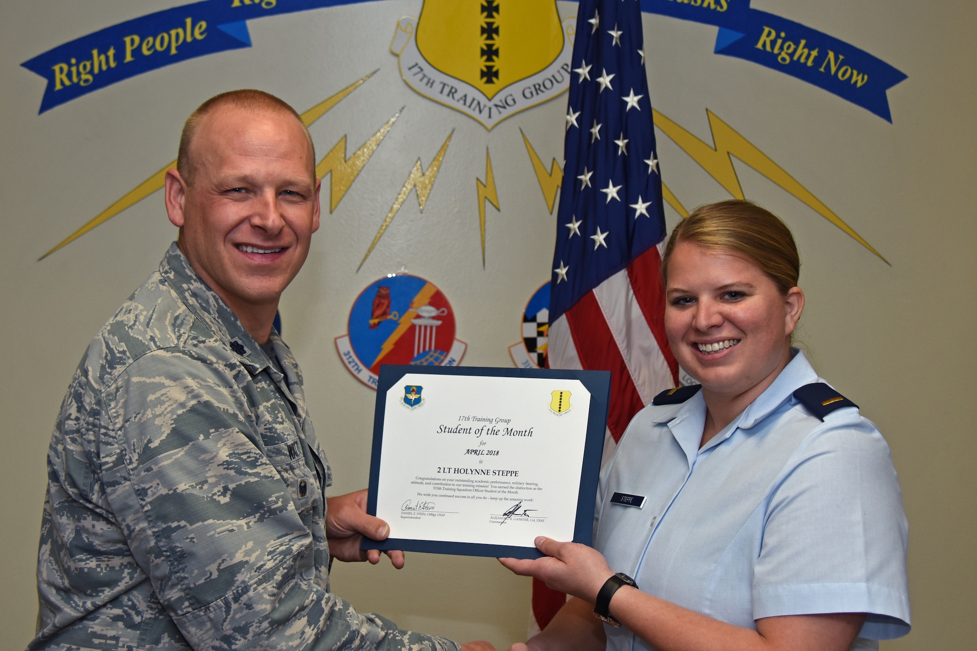 U.S. Air Force Lt. Col. Steven Watts, 17th Training Group deputy commander, presents the 315th Training Squadron Officer Student of the Month award to 2nd Lt. Holynne Steppe, 315th TRS trainee, at Brandenburg Hall on Goodfellow Air Force Base, Texas, May 4, 2018. The 315th TRS’s vision is to develop combat-ready intelligence, surveillance and reconnaissance professionals and promote an innovative squadron culture and identity unmatched across the U.S. Air Force. (U.S. Air Force photo by Airman 1st Class Zachary Chapman/Released)