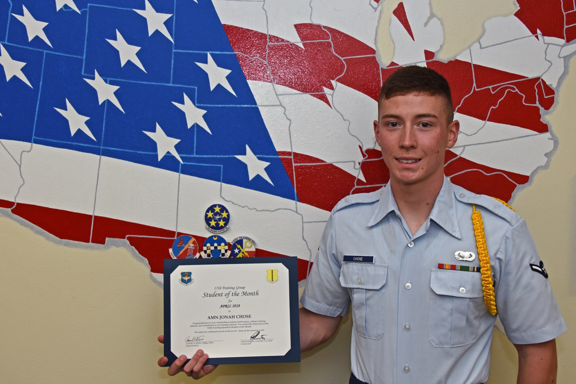 17th Training Group Student of the Month spotlight for May 2018, U.S. Air Force Airman Jonah Chose, 316th Training Squadron trainee, poses with his award at Brandenburg Hall on Goodfellow Air Force Base, Texas, May 4, 2018. Chose is the Goodfellow Student of the Month spotlight for May 2018, a series highlighting Goodfellow students. (U.S. Air Force photo by Airman 1st Class Zachary Chapman/Released)