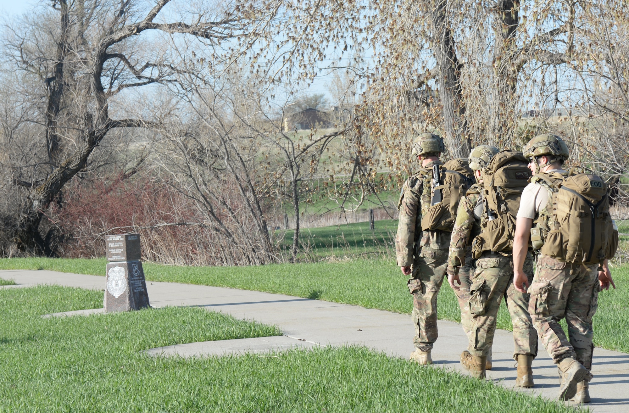 Members of the 28th Civil Engineer Squadron Explosive Ordnance Disposal Flight arrive at the memorial of Staff Sgt. Bryan Berky during 50th Anniversary EOD Memorial Day ruck march at Ellsworth, May 4, 2018. National EOD Memorial Day is designated by Congress as the first Saturday of May to honor of EOD technicians who lost their lives while conducting operations across the globe. (U.S. Air Force photo by Airman 1st Class Nicolas Z. Erwin)