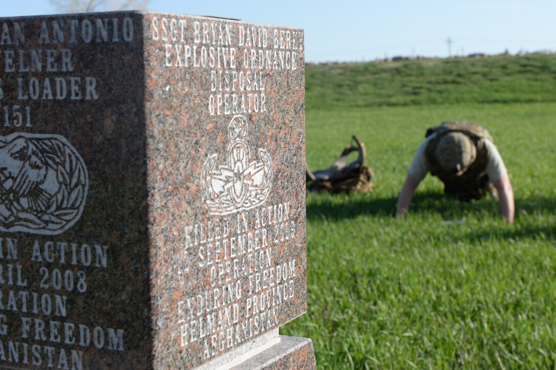 Members of the 28th Civil Engineer Squadron Explosive Ordnance Disposal Flight perform exercises while reciting the fallen EOD members since 9/11 at the memorial of Staff Sgt. Bryan Berky for the 50th Anniversary EOD Memorial Day ruck march at Ellsworth Air Force Base, S.D., May 4, 2018. National EOD Memorial Day is designated by Congress as the first Saturday of May to honor of EOD technicians who lost their lives while conducting operations across the globe. (U.S. Air Force photo by Airman 1st Class Nicolas Z. Erwin)