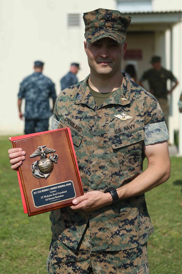 Lt. Nicholas Crossland, a dental officer with Combat Logistics Battalion 31, 31st Marine Expeditionary Unit, received the Lt. J.G. Weedon E. Osbourne Memorial Award at a ceremony May 5, 2018 on Camp Foster, Okinawa, Japan. Crossland earned the award for work he did while deployed with the 31st MEU. The Osborne award is given to dental officers who exhibit superior leadership while serving with the field medical service. (U.S. Marine Corps photo by Lance Cpl. Jamin M. Powell)