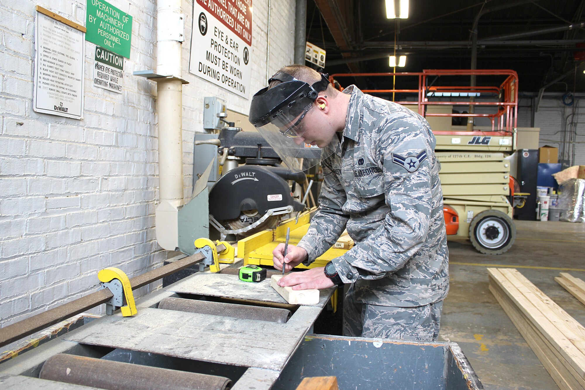 Airman 1st Class Paul Prohaszka, a member of the Structures flight of the 127th Civil Engineer Squadron, works in the wood shop at Selfridge Air National Guard Base, Mich., May 4, 2018. Michigan Citizen-Airmen at Selfridge conducted a four-day training drill at Selfridge to refresh career-specific and warfighting skills. (U.S. Air National Guard photo by Tech. Sgt. Dan Heaton)