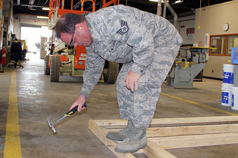 Airman 1st Class Paul Prohaszka, a member of the Structures flight of the 127th Civil Engineer Squadron, works in the wood shop at Selfridge Air National Guard Base, Mich., May 4, 2018. Michigan Citizen-Airmen at Selfridge conducted a four-day training drill at Selfridge to refresh career-specific and warfighting skills. (U.S. Air National Guard photo by Tech. Sgt. Dan Heaton)