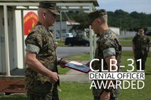 Brig. Gen. Daniel B. Conley, commanding general of 3rd Marine Logistics Group, awards Lt. Nicholas Crossland, a dental officer with Combat Logistics Battalion 31, 31st Marine Expeditionary Unit, with the Lt. J.G. Weedon E. Osbourne Memorial Award May 5, 2018 on Camp Foster. Crossland was awarded this for his work while attached to the 31st MEU. The Osborne award is given to dental officers who exhibit superior leadership while serving with the field medical service. (U.S. Marine Corps photo by Lance Cpl. Jamin M. Powell)