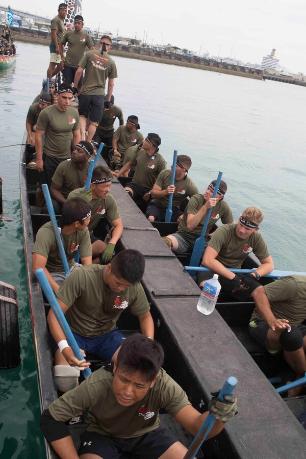 Soldiers with the Japanese Ground Self Defense Force’s 15th Engineer Company and Marines with 9th Engineer Support Battalion, Combat Logistics Regiment 35, 3rd Marine Logistics Group, settle into the Dragon Boat before taking off for the race May 5, 2018 in Tomari Port, Okinawa, Japan. The combined team, called the Double Dragons, faced Army and Navy dragon boat teams during the annual Naha Hari Dragon Boat races during Okinawa’s Golden Week celebration. (U.S. Marine Corps photo by Lance Cpl. Jamin M. Powell)