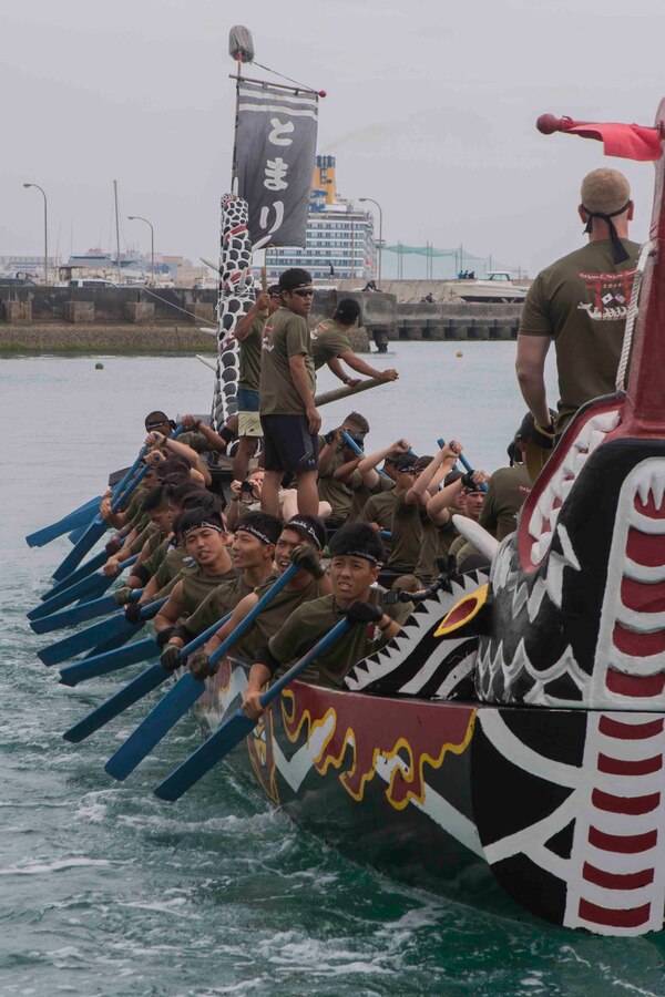 Soldiers with the Japanese Ground Self Defense Force’s 15th Engineer Company and Marines with 9th Engineer Support Battalion, 3rd Marine Logistics Group, paddle to the starting positions for the Dragon Boat race May 5, 2018 in Tomari Port, Okinawa, Japan. The combined team, called the Double Dragons, faced Army and Navy dragon boat teams during the annual Naha Hari Dragon Boat races during Okinawa’s Golden Week celebration. (U.S. Marine Corps photo by Lance Cpl. Jamin M. Powell)
