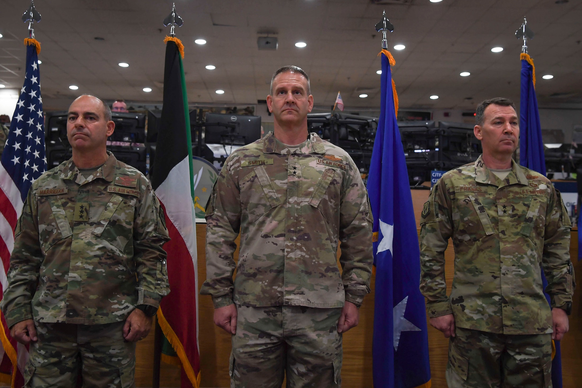 Lt. Gen. Jeffrey Harrigian (left), United States Air Force Central Command commander, Maj. Gen. Dirk Smith (middle) and Maj. Gen. Chad Franks (right) stand at attention during a change of command ceremony May 5, 2018, at an undisclosed location in Southwest Asia.